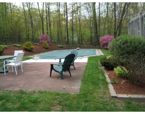 86 Purgatory Road Sutton, MA 01590 - Photo 8 of 16 a backyard of a house with table and chairs