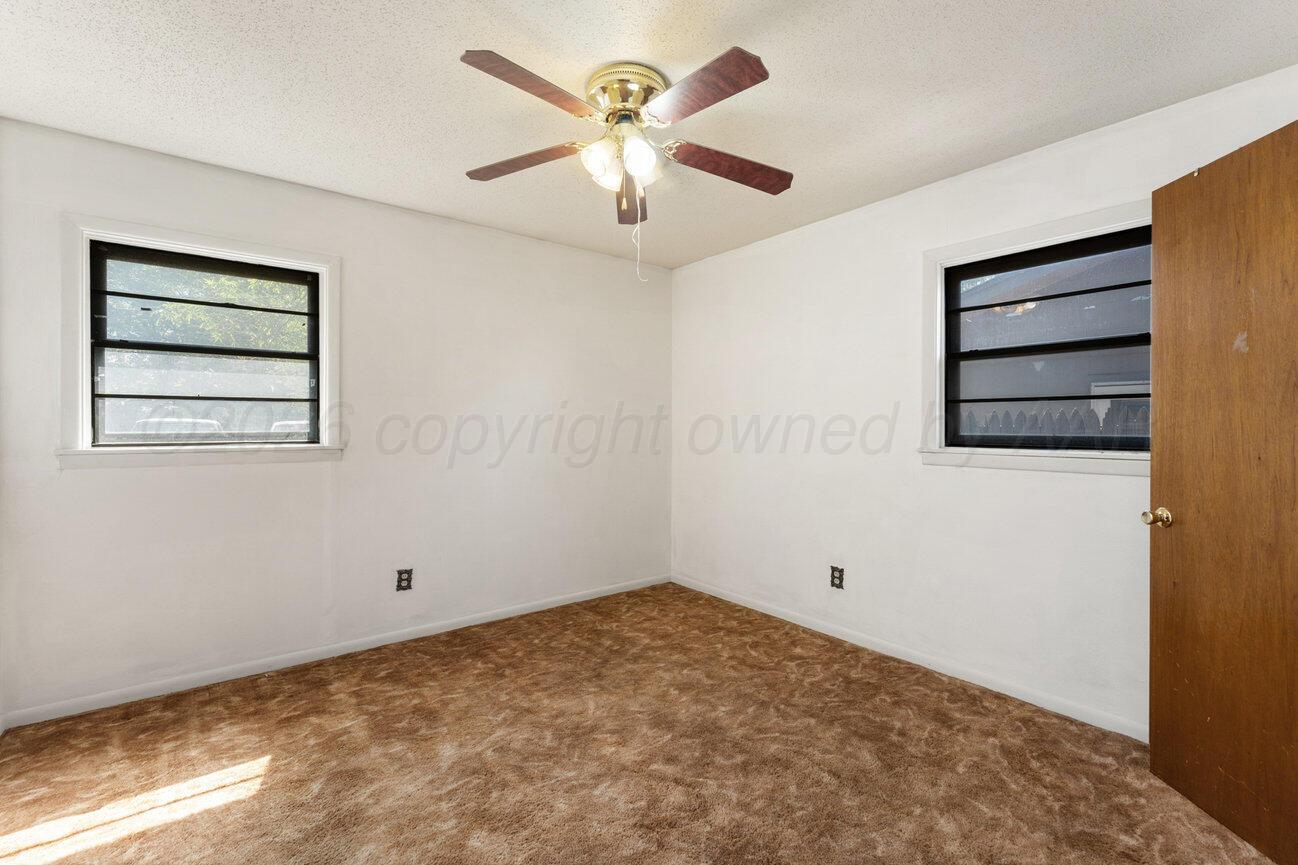 4305 South Bonham Street Amarillo, TX 79110 - Photo 48 of 48 a view of room with ceiling fan and window