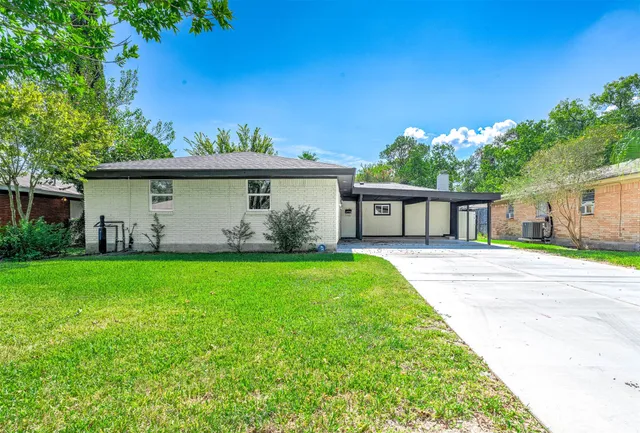 a house view with a garden space