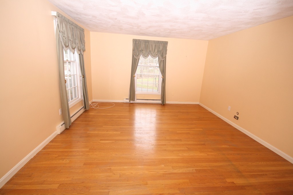 1 Whiting Road Framingham, MA 01701 - Photo 15 of 28 a view of an empty room with wooden floor and a window