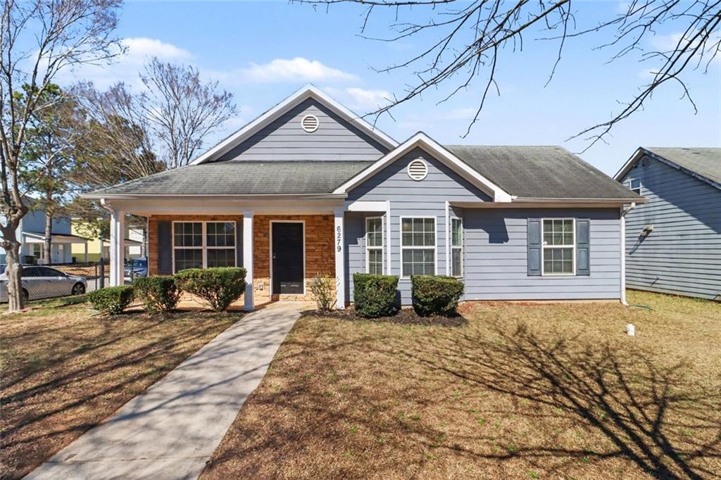 6279 Avery Street Southwest Covington, GA 30014 - Photo 1 of 21 a front view of a house with a patio