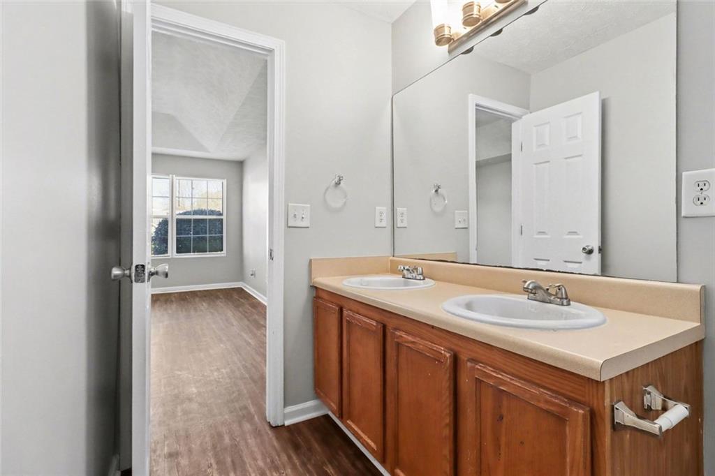 6279 Avery Street Southwest Covington, GA 30014 - Photo 11 of 21 a bathroom with a sink and a mirror