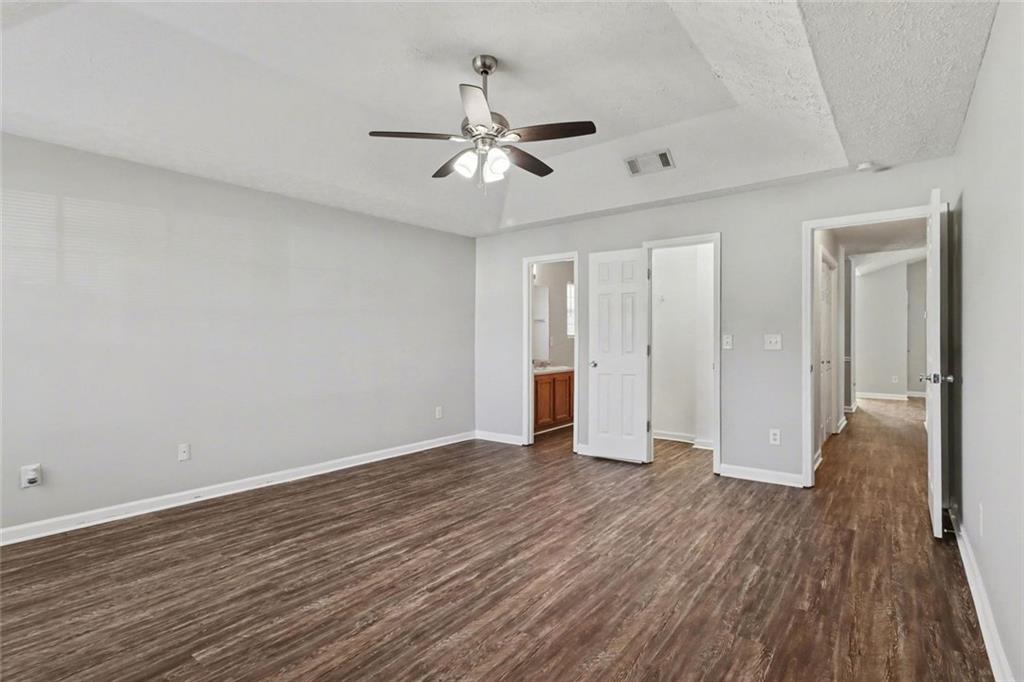 6279 Avery Street Southwest Covington, GA 30014 - Photo 13 of 21 a view of an empty room with wooden floor