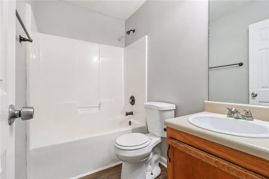 6279 Avery Street Southwest Covington, GA 30014 - Photo 14 of 21 a bathroom with a sink toilet and shower