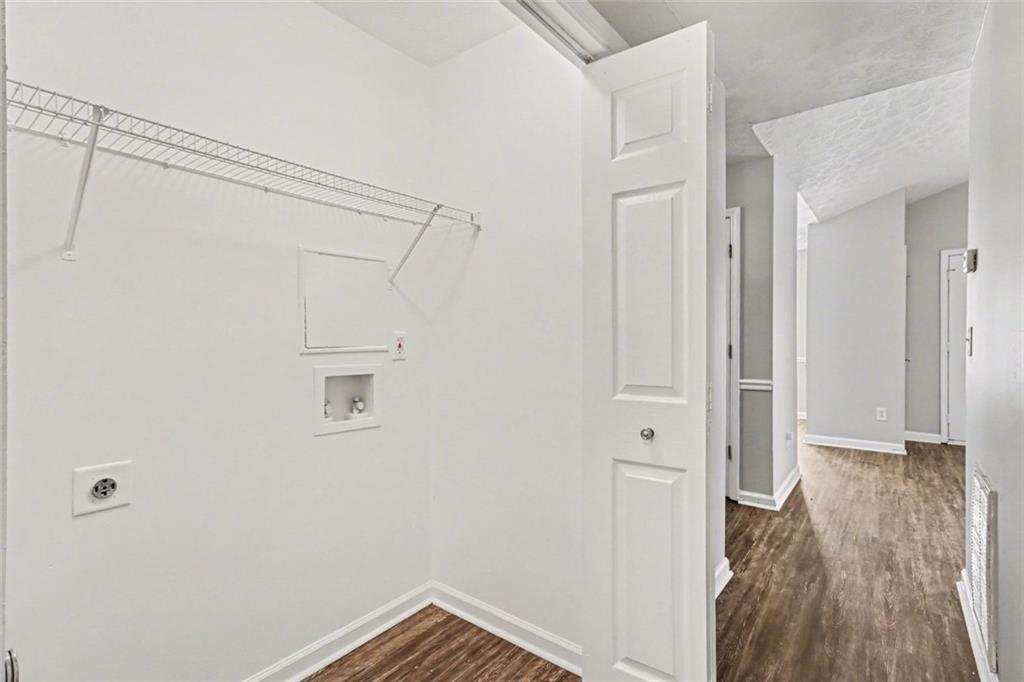 6279 Avery Street Southwest Covington, GA 30014 - Photo 15 of 21 a view of walk in closet with empty racks