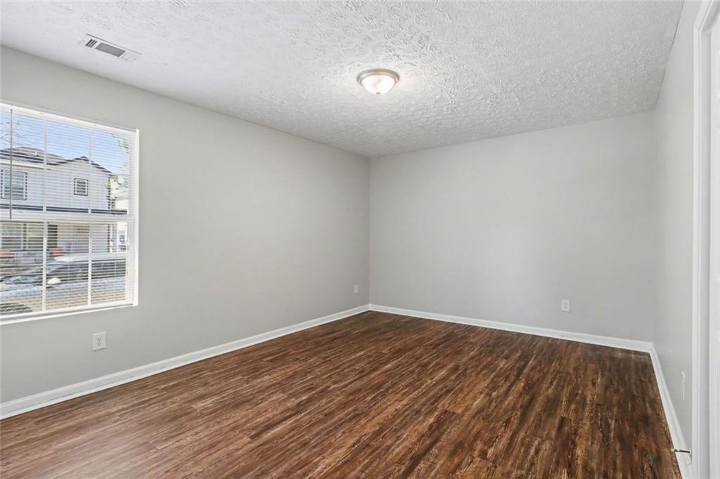 6279 Avery Street Southwest Covington, GA 30014 - Photo 16 of 21 wooden floor in a room