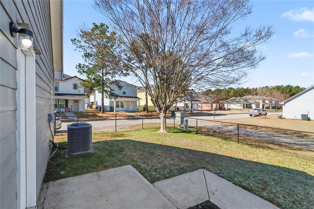 6279 Avery Street Southwest Covington, GA 30014 - Photo 19 of 21 a view of a house with garden and trees