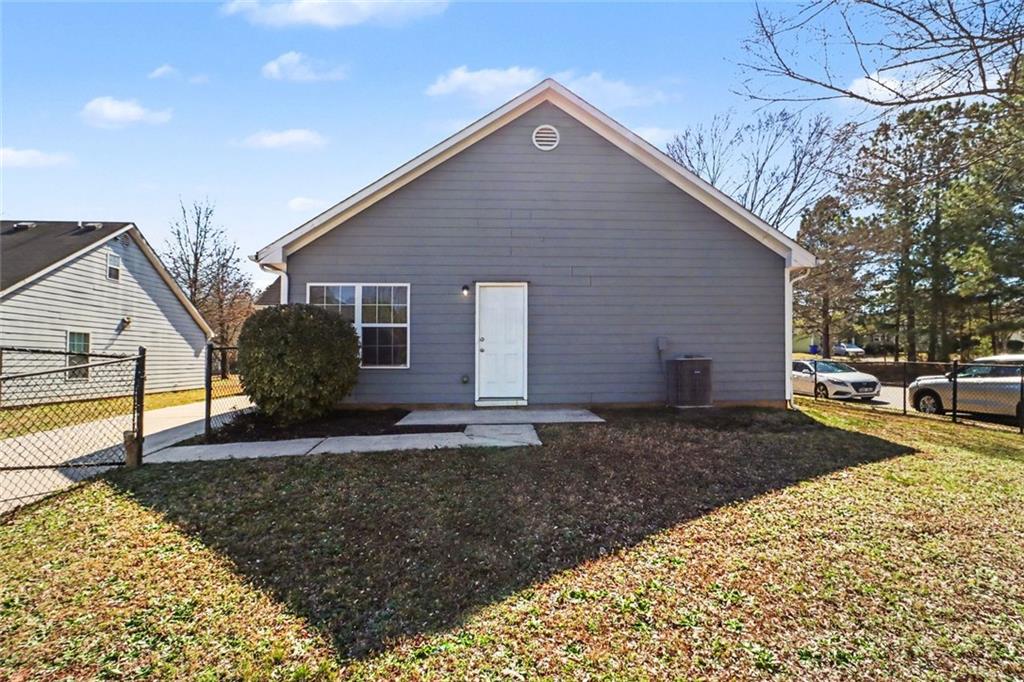 6279 Avery Street Southwest Covington, GA 30014 - Photo 21 of 21 a view of a house with a yard