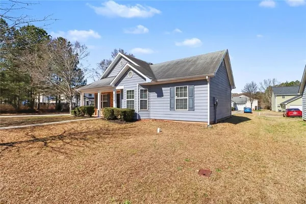 a front view of a house with a yard