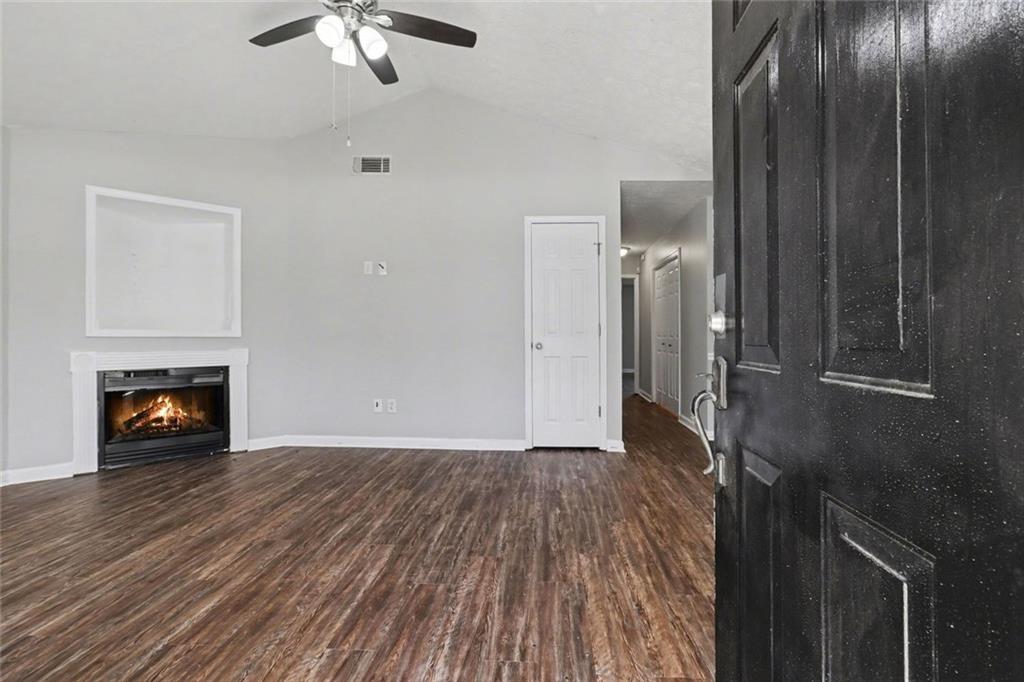 6279 Avery Street Southwest Covington, GA 30014 - Photo 4 of 21 a view of livingroom with furniture and fireplace
