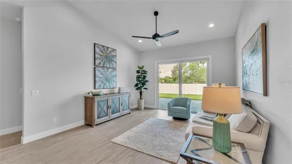 a living room with furniture and a large window