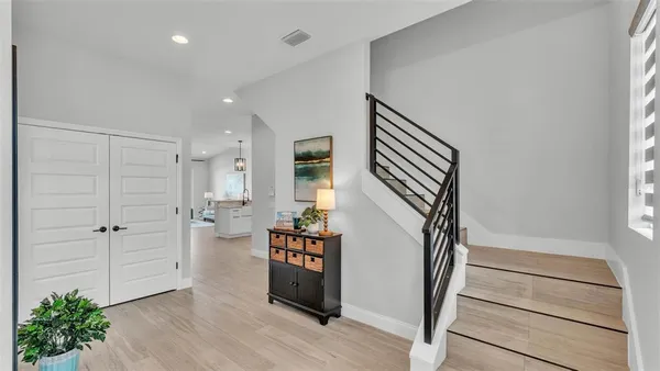 a view of entryway with wooden floor