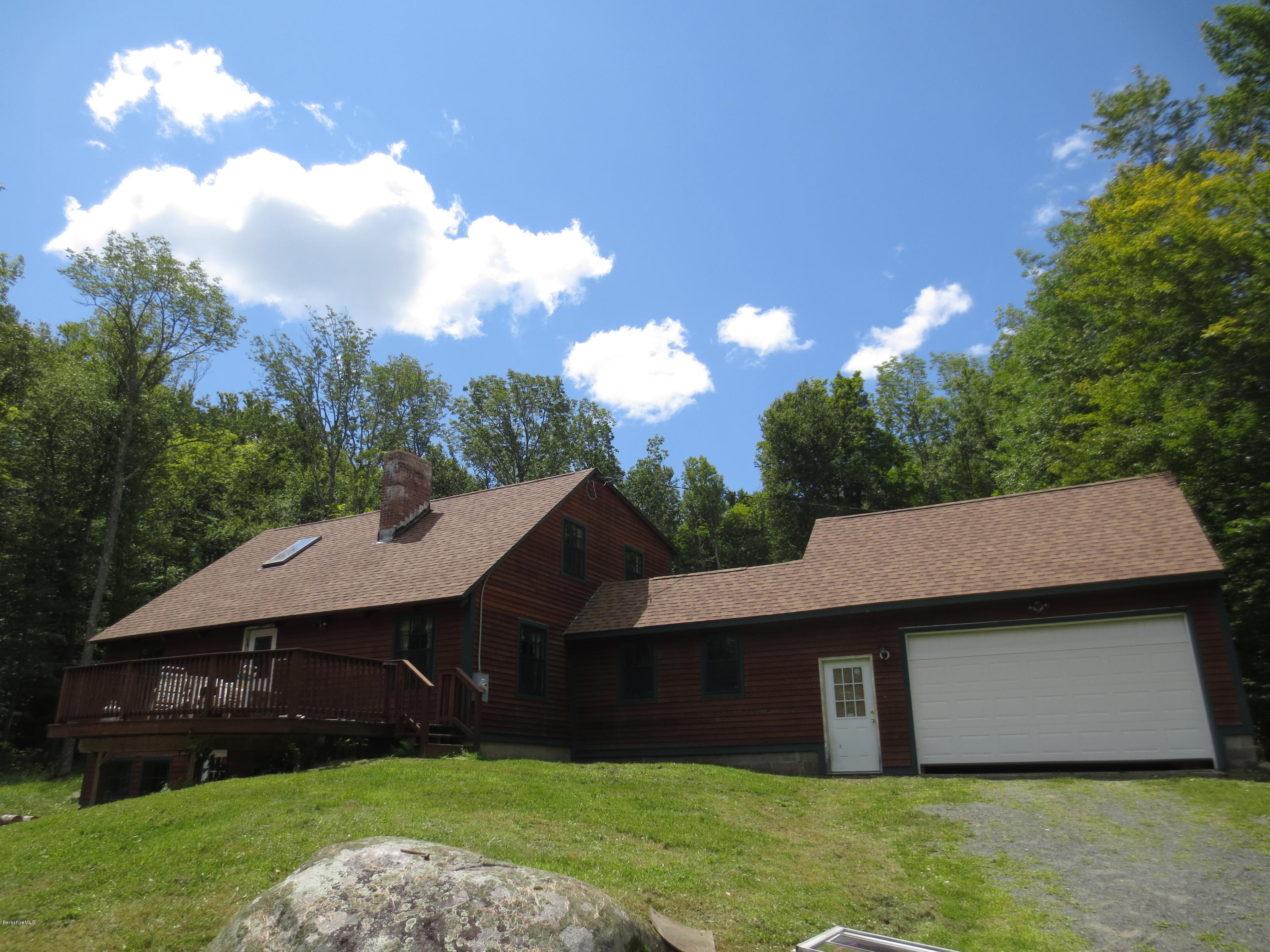 87 Crane Road Chester, MA 01011 - Photo 2 of 16 a view of a house with a backyard