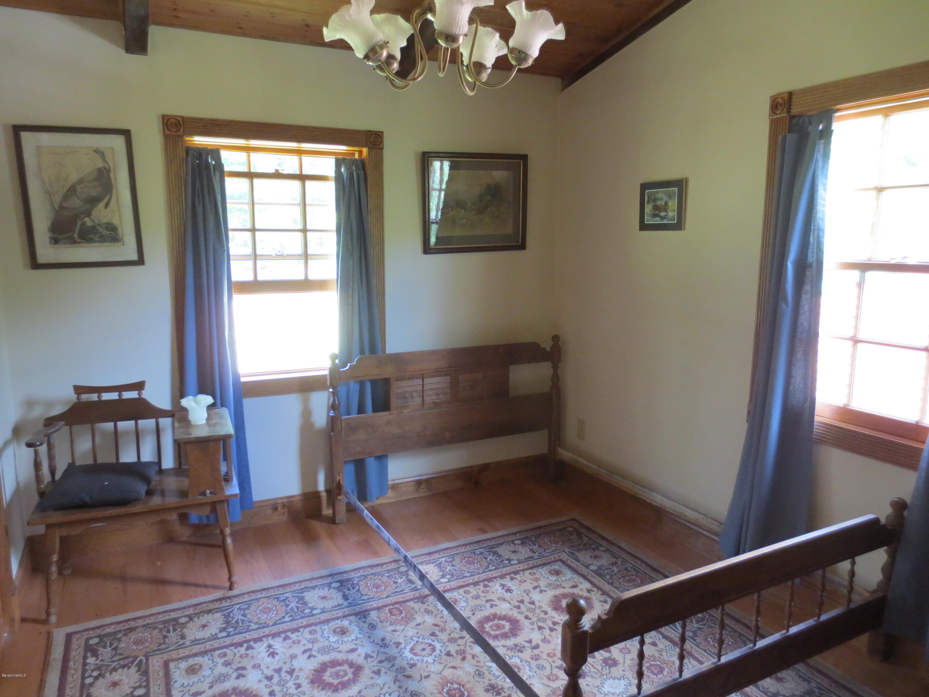 87 Crane Road Chester, MA 01011 - Photo 11 of 16 a living room with furniture and a window