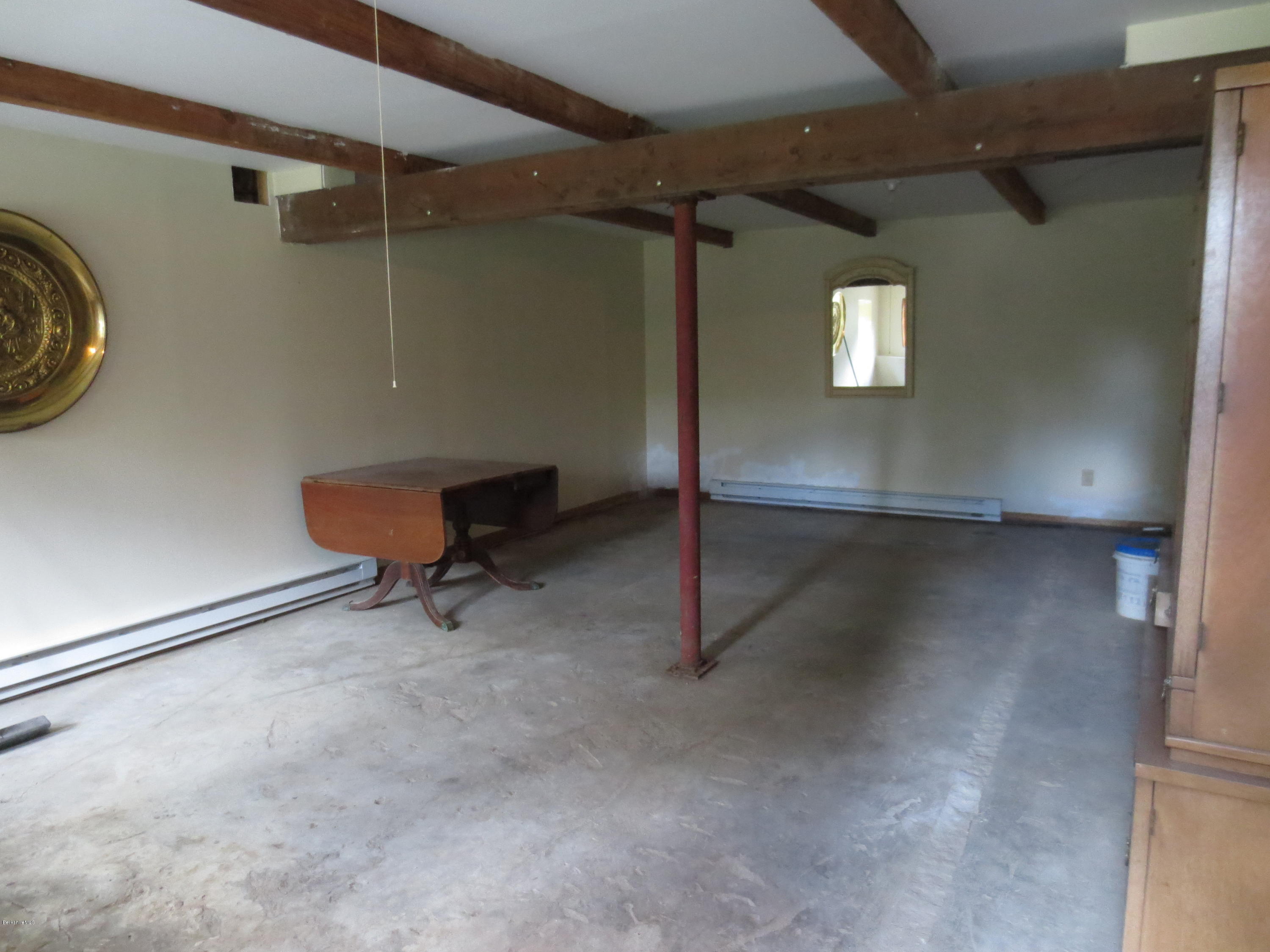 87 Crane Road Chester, MA 01011 - Photo 13 of 16 a view of a room with racks on the wall