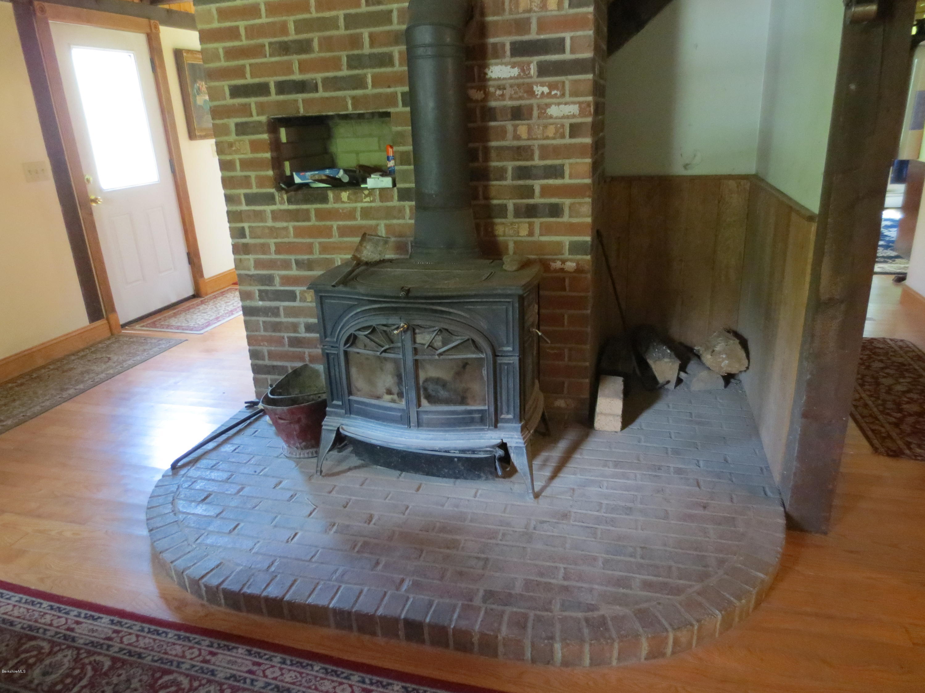 87 Crane Road Chester, MA 01011 - Photo 6 of 16 a view of living room with furniture and a fireplace