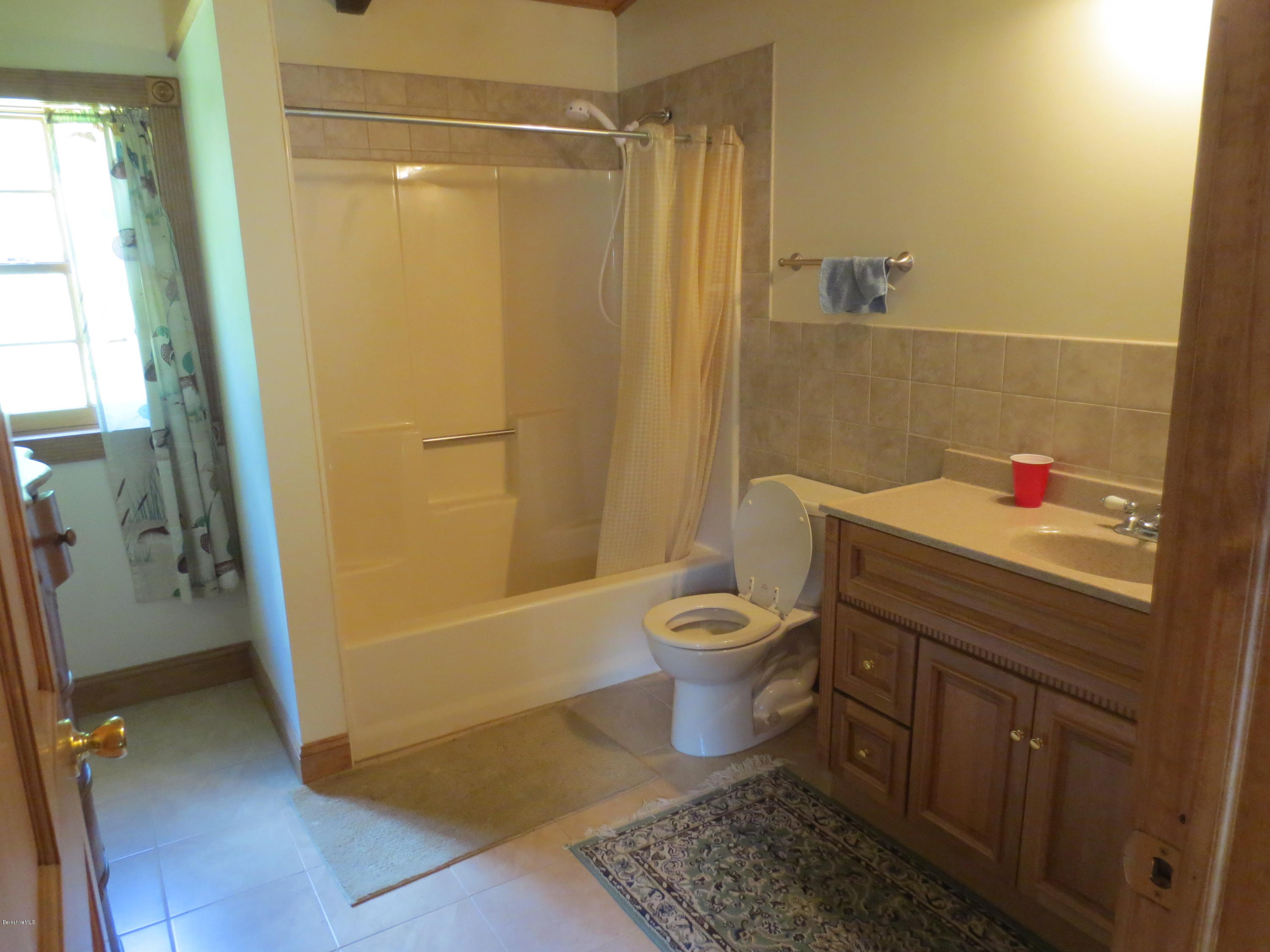 87 Crane Road Chester, MA 01011 - Photo 10 of 16 a bathroom with a sink and a mirror
