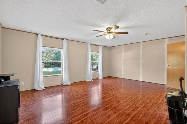 a living room with furniture fireplace and flat screen tv