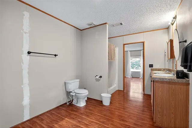 a spacious bathroom with a tub shower and sink