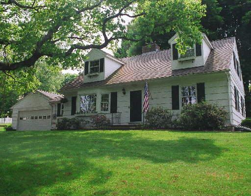 31 Hanover Road Newtown, CT 06470 - Photo 1 of 1 a front view of a house with a garden and yard