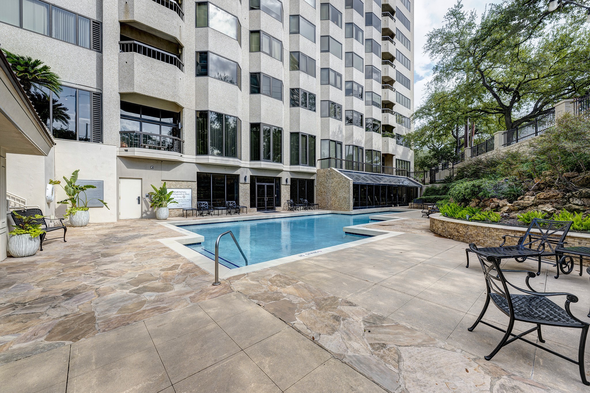 2001 Holcombe Boulevard, Unit 2304 Houston, TX 77030 - Photo 14 of 19 a view of a chairs with a table and chairs in patio