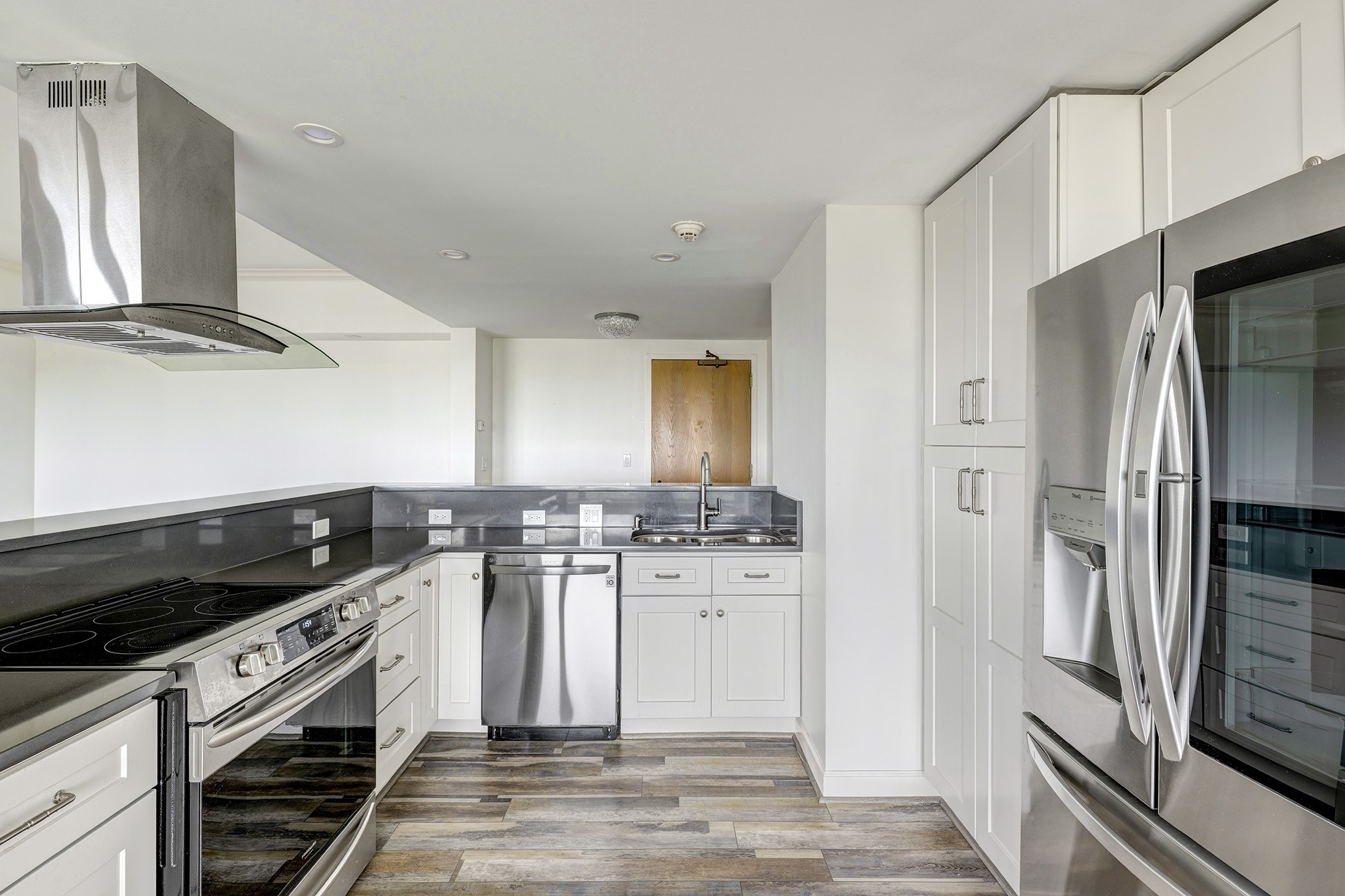 2001 Holcombe Boulevard, Unit 2304 Houston, TX 77030 - Photo 5 of 19 a kitchen with stainless steel appliances a refrigerator stove and sink