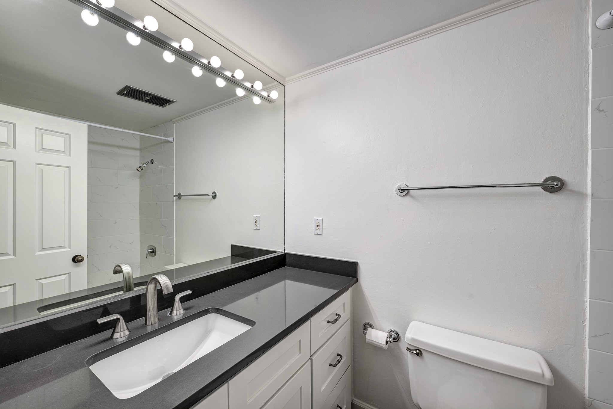 2001 Holcombe Boulevard, Unit 2304 Houston, TX 77030 - Photo 10 of 19 a bathroom with a sink vanity granite and toilet