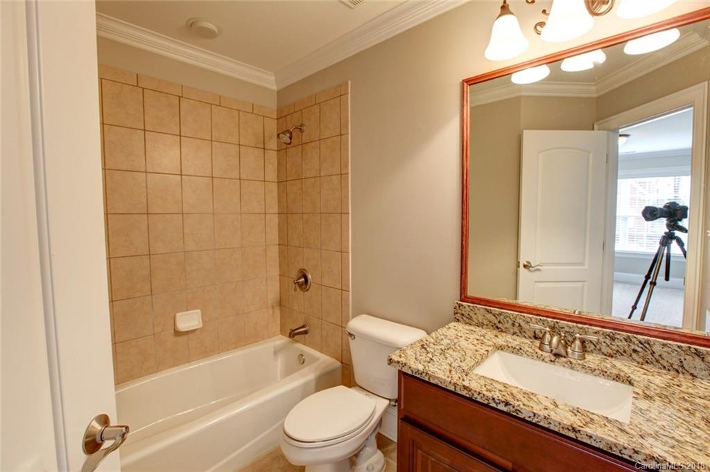 272 Hemmingway Lane Fort Mill, SC 29708 - Photo 16 of 24 a bathroom with a granite countertop bathtub shower sink vanity mirror and toilet