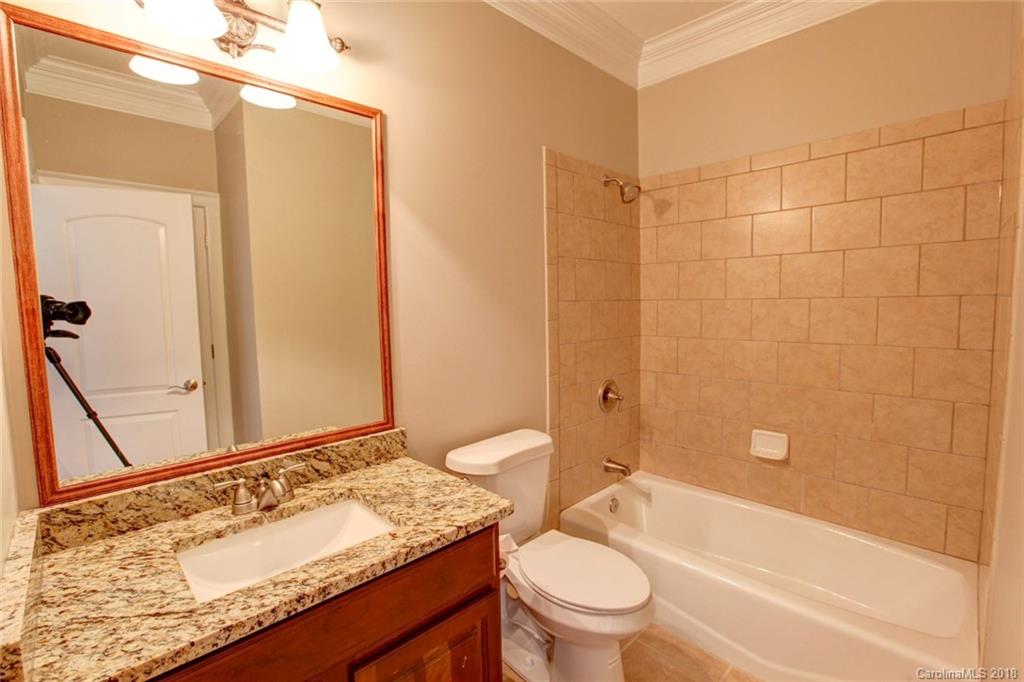 272 Hemmingway Lane Fort Mill, SC 29708 - Photo 18 of 24 a bathroom with a granite countertop sink toilet and shower