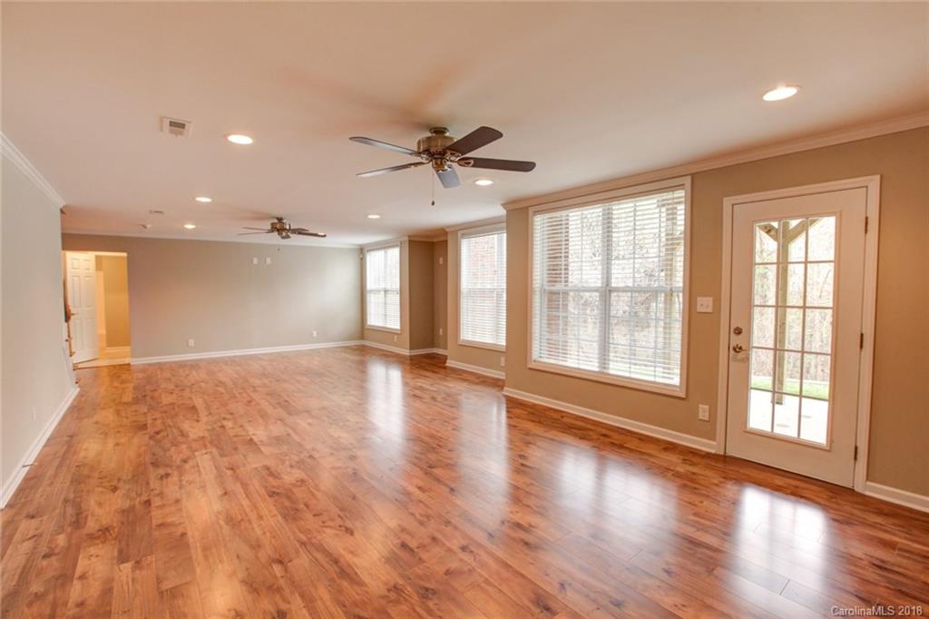 272 Hemmingway Lane Fort Mill, SC 29708 - Photo 20 of 24 a view of an empty room with a window and wooden floor