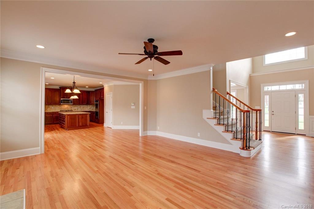 272 Hemmingway Lane Fort Mill, SC 29708 - Photo 7 of 24 a view of an empty room with wooden floor