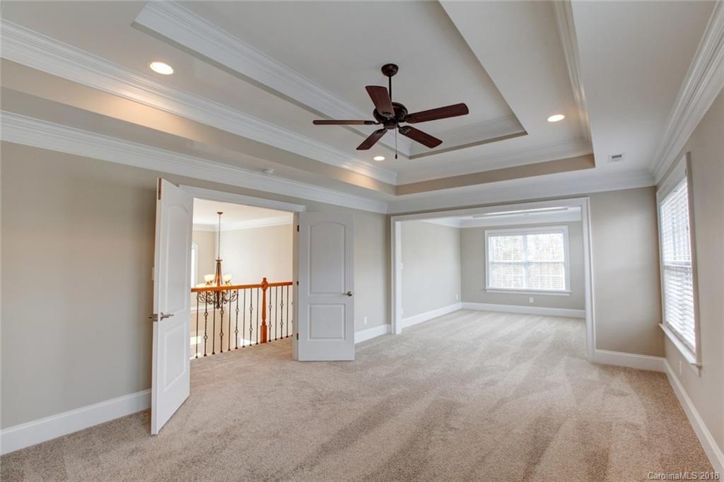 272 Hemmingway Lane Fort Mill, SC 29708 - Photo 10 of 24 a view of a livingroom with a ceiling fan and window