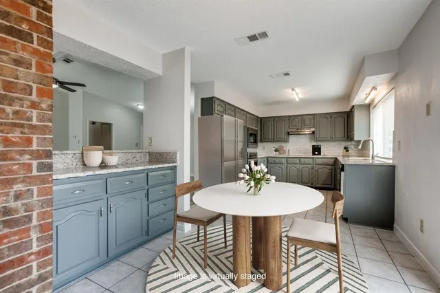a kitchen with a sink cabinets and counter space