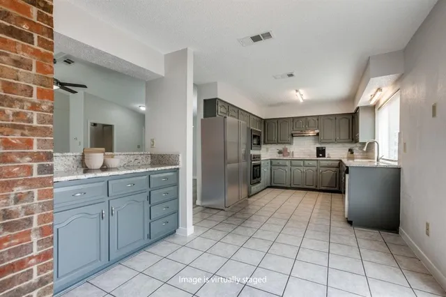 a large kitchen with a cabinets and counter space