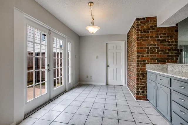 a view of empty room with windows