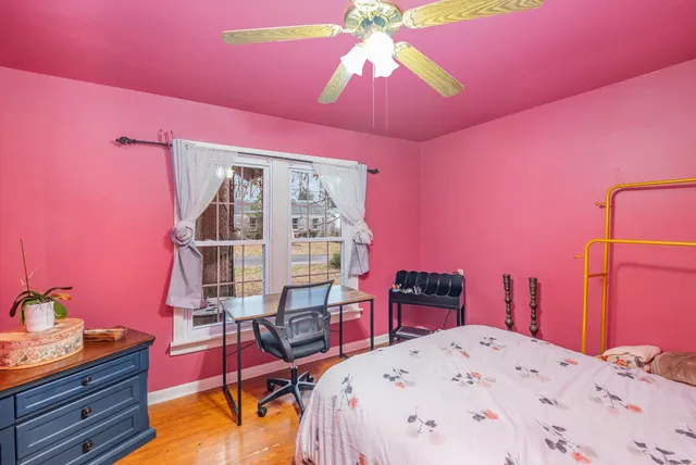 a bed room with a bed and a chandelier