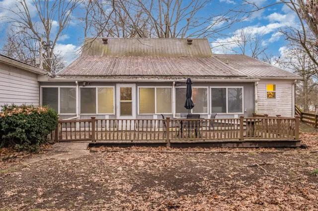 a house that has a tree in front of it