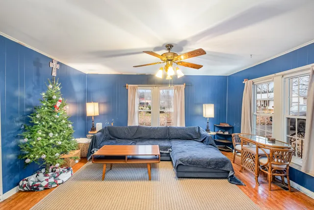 a living room with furniture and a large window
