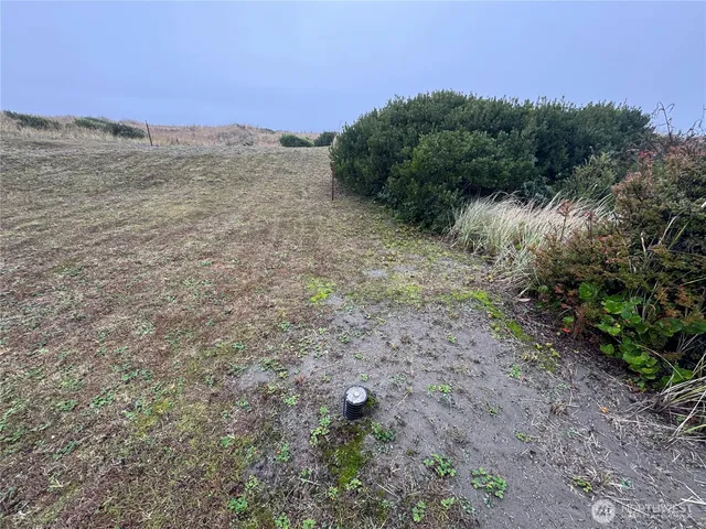 a view of a road with a mountain in the background