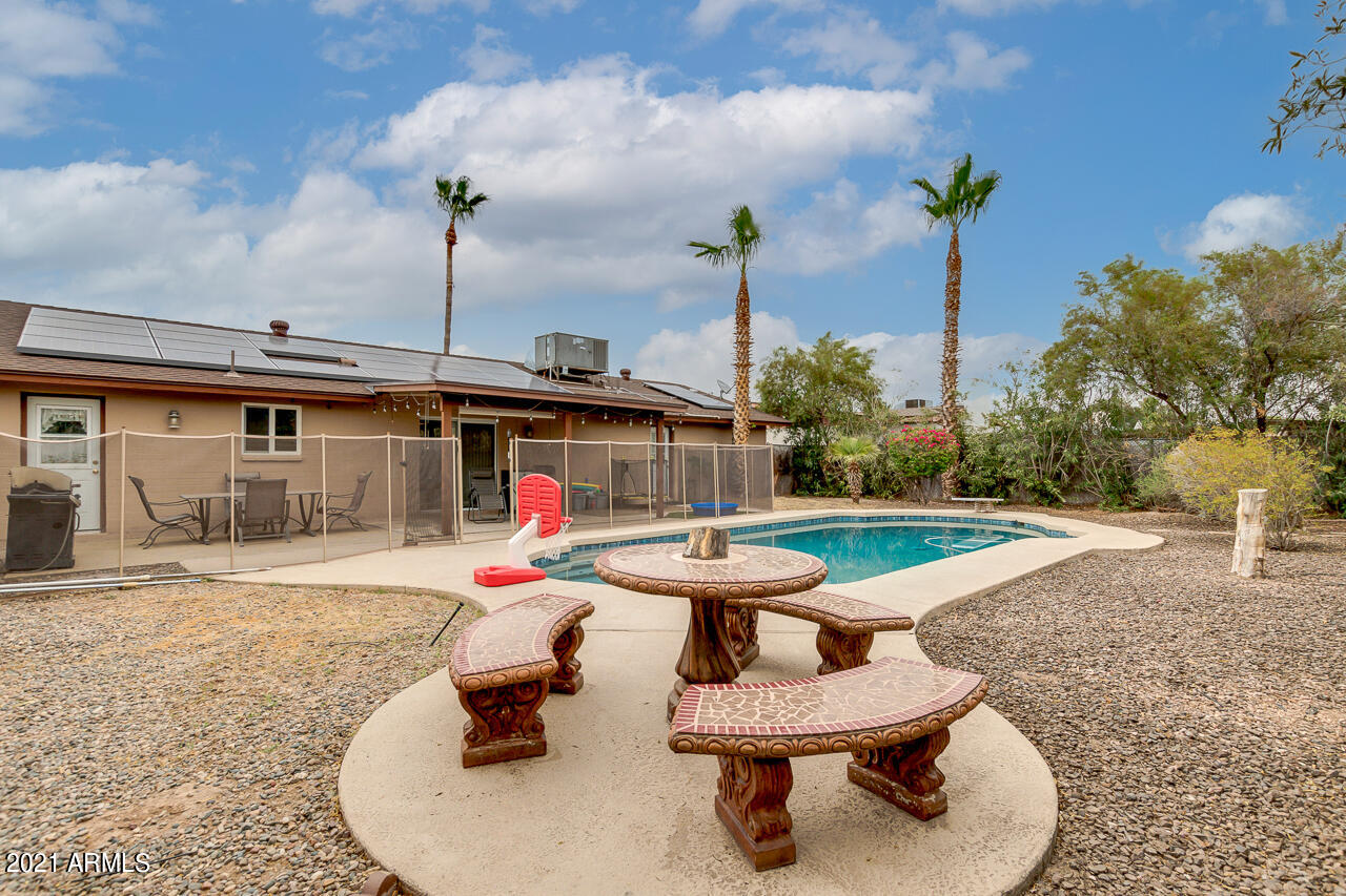 4215 West Dailey Street Phoenix, AZ 85053 - Photo 28 of 32 a swimming pool with outdoor seating