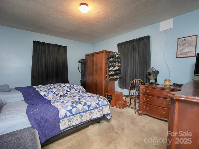 a bedroom with a bed and a closet