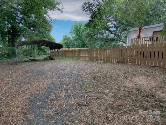 a view of a backyard with trees