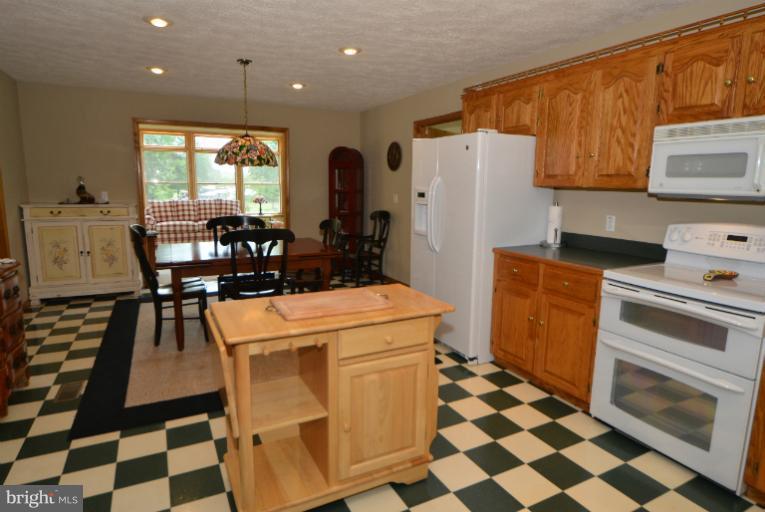 11034 Lucks Road Bumpass, VA 23024 - Photo 14 of 30 The kitchen features GE appliances.
