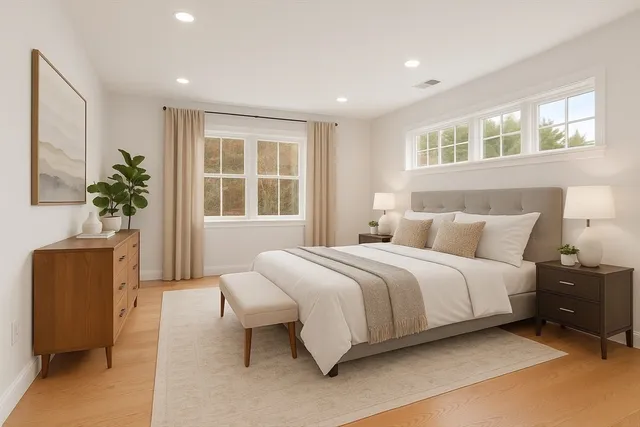 a spacious bedroom with a bed and a couch