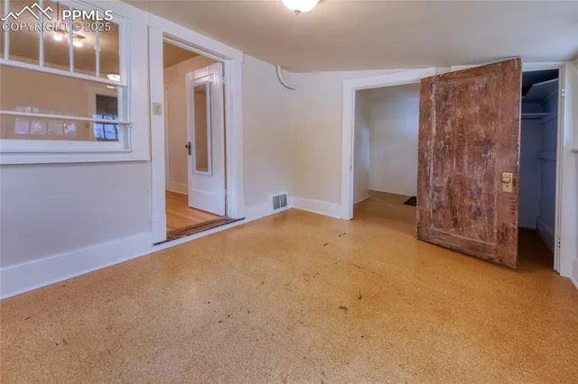 an empty room with windows