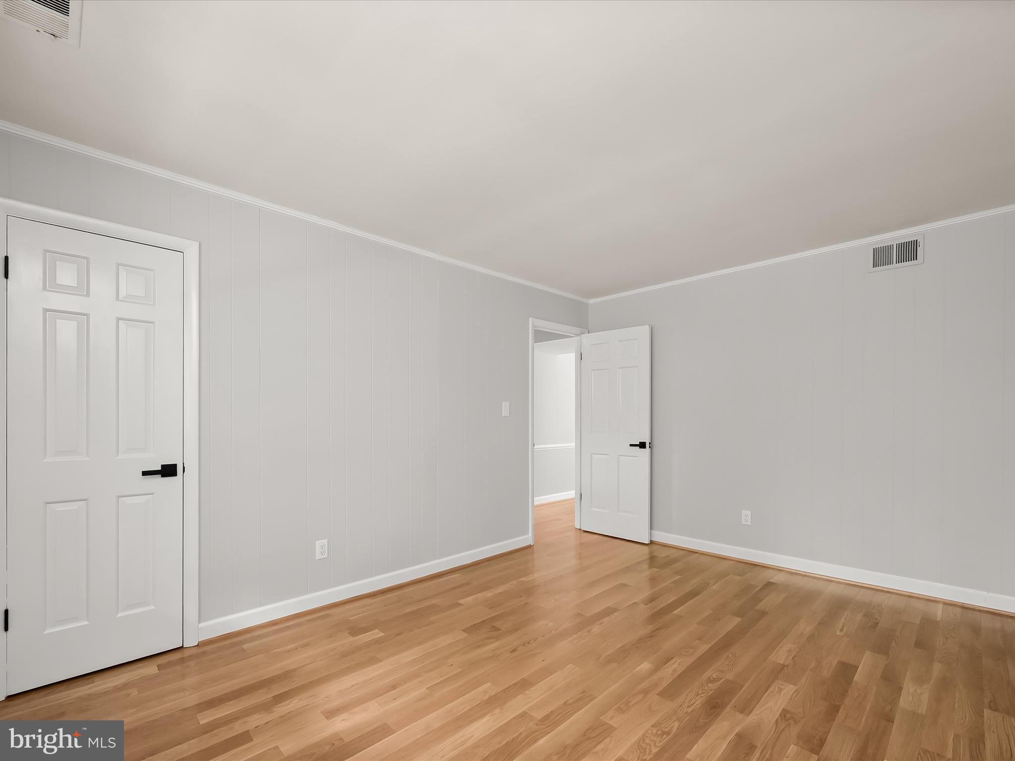 12402 Benson Branch Road Ellicott City, MD 21042 - Photo 34 of 77 Main Level Bedroom 5- Hardwood Floors