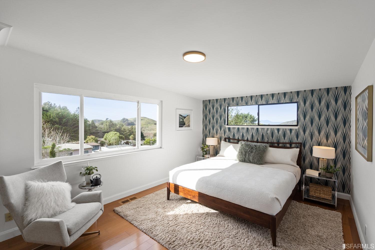 296 Reichling Avenue Pacifica, CA 94044 - Photo 14 of 39 a bedroom with a bed and a large window