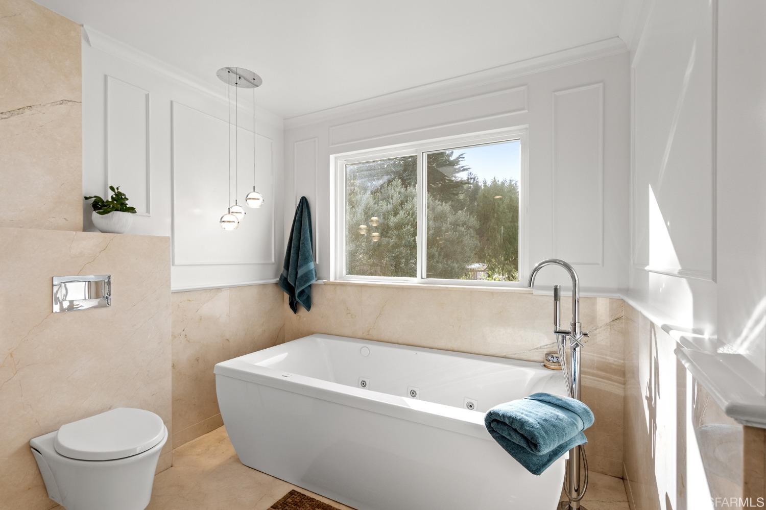 296 Reichling Avenue Pacifica, CA 94044 - Photo 19 of 39 a bath tub sitting next to a toilet and a sink