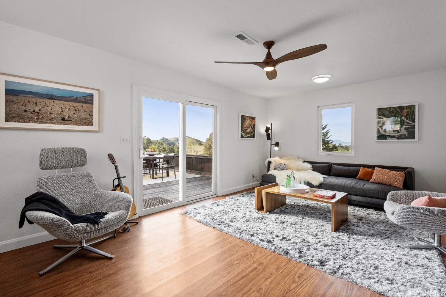 296 Reichling Avenue Pacifica, CA 94044 - Photo 22 of 39 a living room with furniture and a wooden floor