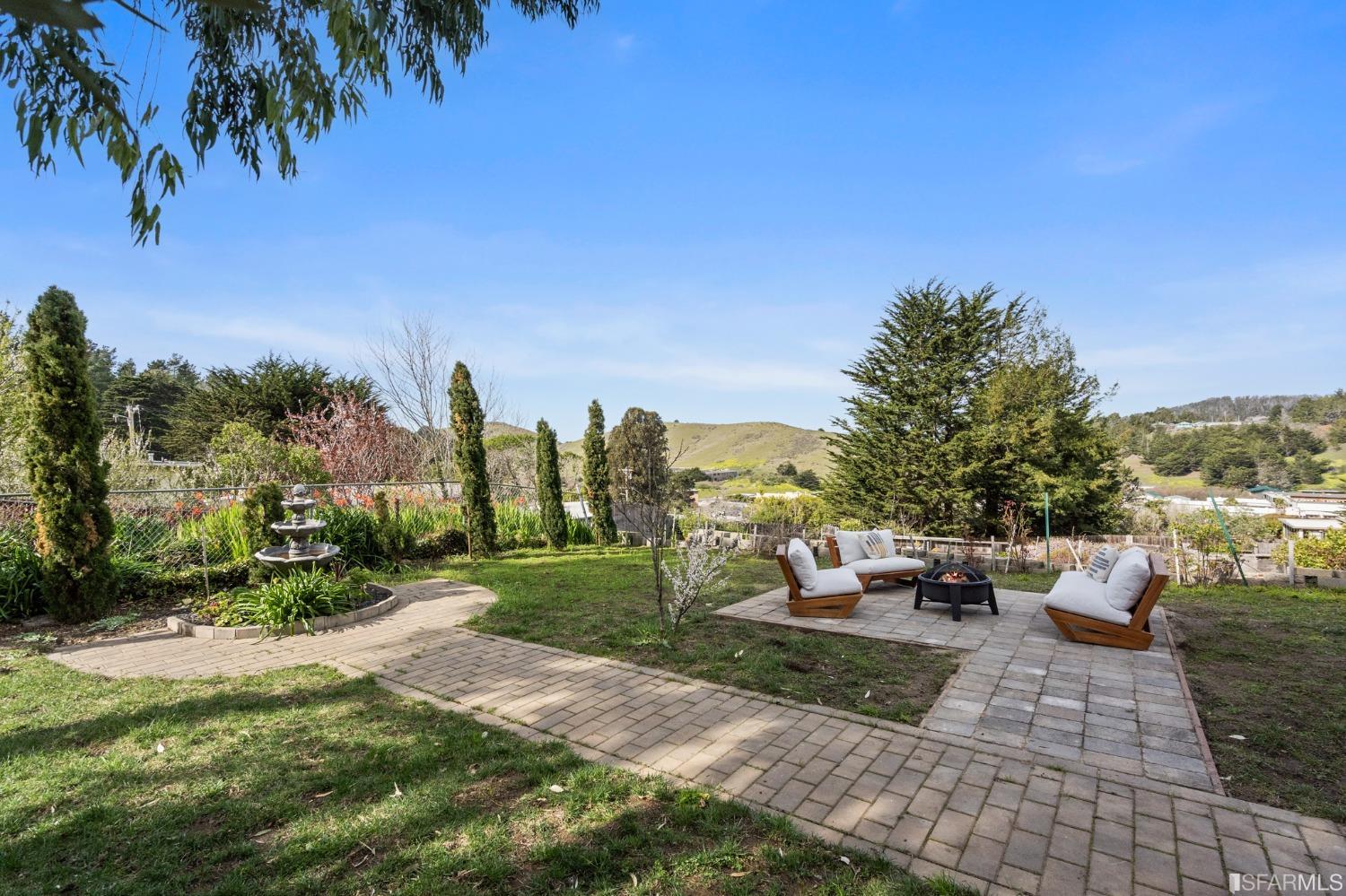 296 Reichling Avenue Pacifica, CA 94044 - Photo 30 of 39 a view of a patio with couches and table and chairs and potted plants